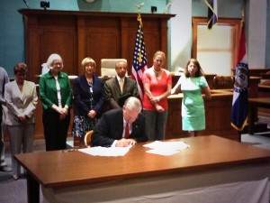 Nixon signs Senate bills 205 and 208 at the Boone County Courthouse Thursday morning.