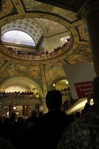 Hundreds of people gather in the first, second and third floor of the Capitol during a Medicaid rally in April to hear Gov. Jay Nixon, and several health care professionals, speak during a break in the listener’s lobbying efforts. (Photo taken by Ashley Jost) 