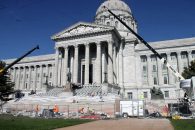 Construction crews work to lay the old marble stones back in place on the front steps of the Capitol in Jefferson City. (Benjamin Peters/ The Missouri Times)