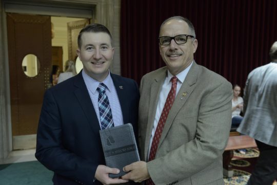 Rep. Chuck Basye presented Anthes with the Warrior's Bible after the passage of the veteran education bill, SB 968, in 2016 session. (Photo provided by Erik Anthes)