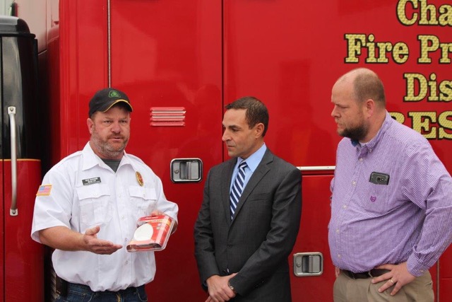 Chamois Fire Assistant Chief Sean Hackman, Missouri Care President Lou Gianquinto, and Community Christian Church Pastor Jeff Kruger announce fire safety program.