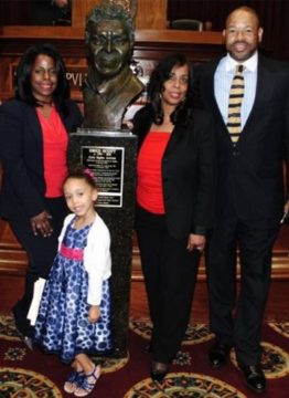 Lynne Jackson and family beside a statue of Dred Scott. (Photo provided by Lynne Jackson)